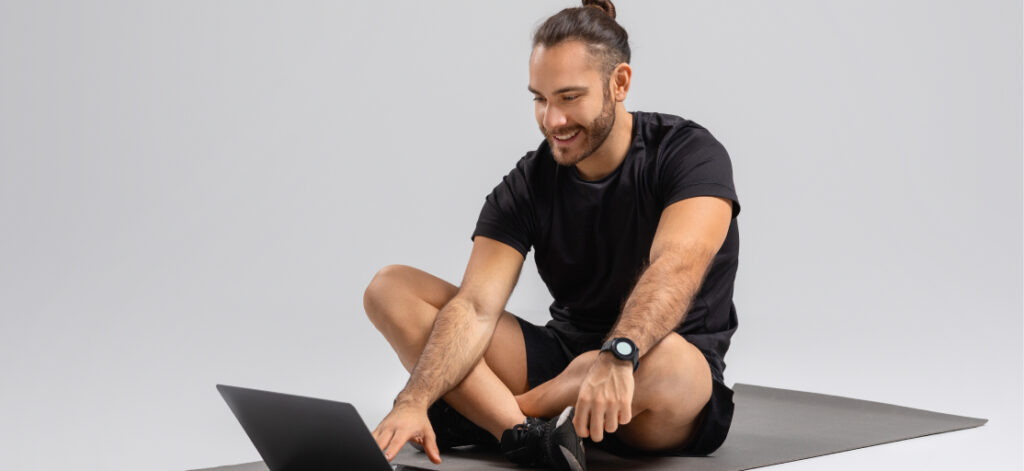 Fitness professional managing gym operations with technology
